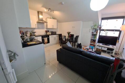 Open-plan living area with modern kitchen...