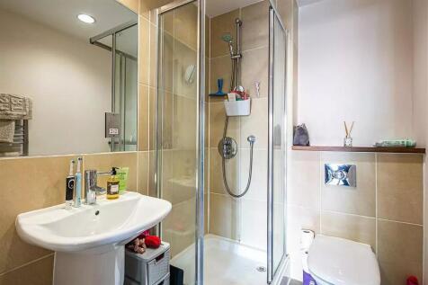 Bright and clean bathroom featuring a modern co...