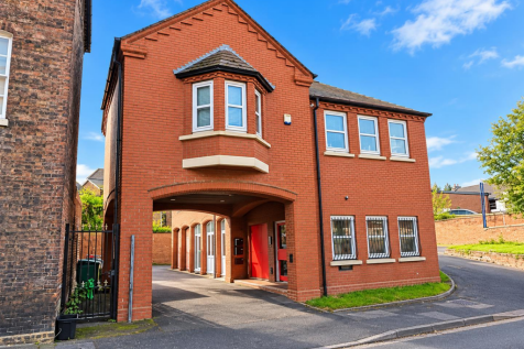 Sunny Red-Brick Courtyard Entrance.png