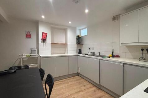 Modern fitted kitchen with ample dining space...