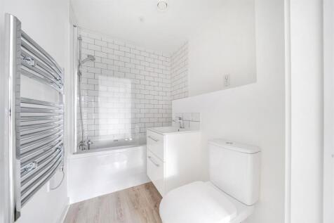 Modern bathroom with stylish subway tiles and t...