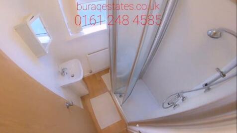 Bright modern shower room with natural light....