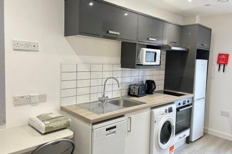 Modern kitchen with integrated appliances...