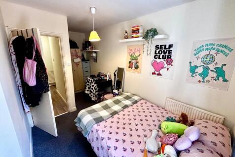 A cozy and well-decorated living space with liv...