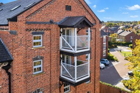 Red Brick Balconies Under Blue Skies.jpg