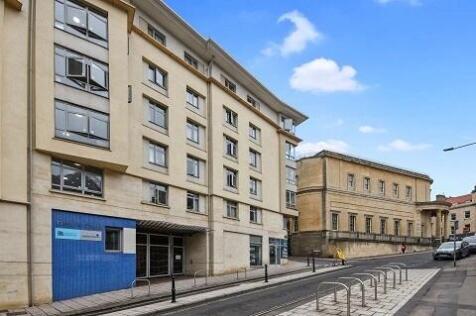 Modern urban exterior under a bright blue sky...