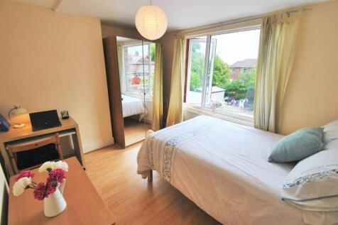 Bright bedroom with double bed and study desk...