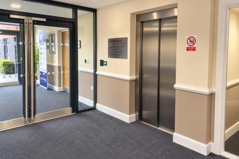Modern Lobby with Elevator and Glass Entrance.jpg