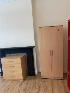 Bright bedroom with ample storage and character...