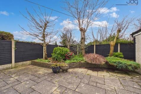 Spacious South facing flagged garden and connected Garage