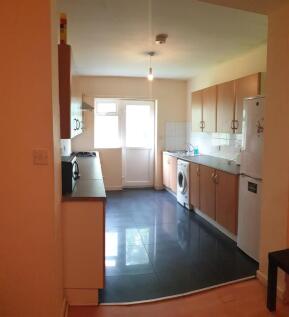 Long galley kitchen with a range of wall and ba...