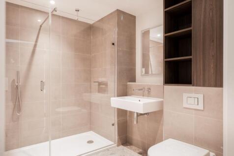 Step into luxury with this contemporary bathroom design, featuring chic finishes and ample storage solutions.