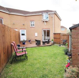 Spacious lawn and sunny deck for socialising...
