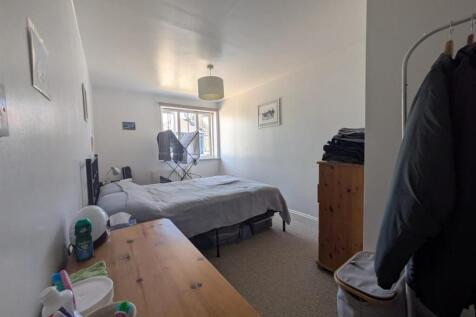 Bright and airy bedroom with ample storage spac...