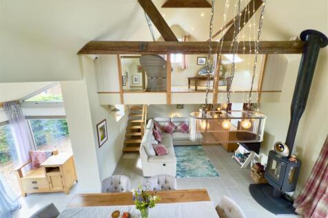 living space with vaulted ceilin