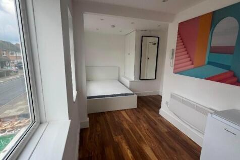 Bright single bedroom with a large front-facing...