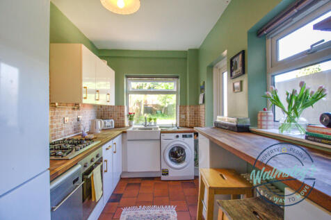 Kitchen with door to garden &amp; breakfast bar