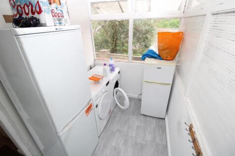 Bright utility space with ample storage applian...