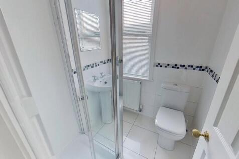 Bright and clean bathroom with a modern shower ...