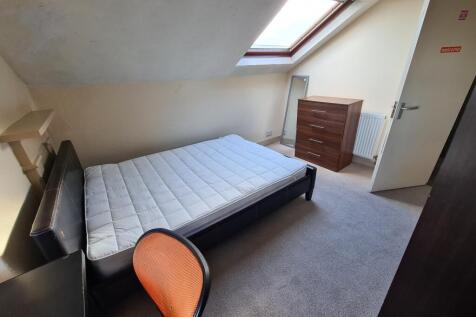 Bright and cozy double bedroom featuring a comf...