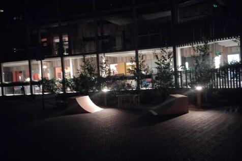 Front of Church Grove flats at night