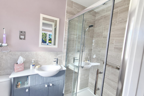 Bright Modern Bathroom with Glass Shower.png