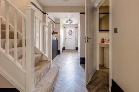 The entrance hall is welcoming with a downstairs WC