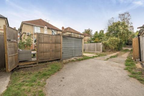Garage and through Gate into Garden