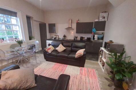 Bright and welcoming living room featuring a co...