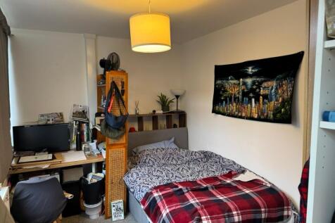 Bright and cozy bedroom with a comfortable doub...