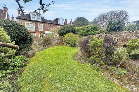 Spacious private garden with lush green lawn...