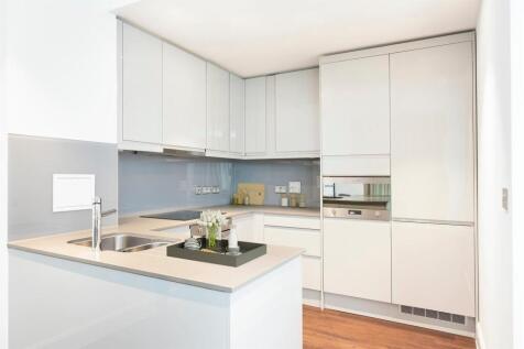 Explore the elegance and functionality of this sleek modern kitchen, perfect for culinary creativity.