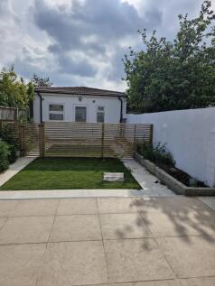 Modern private garden with stylish patio area...
