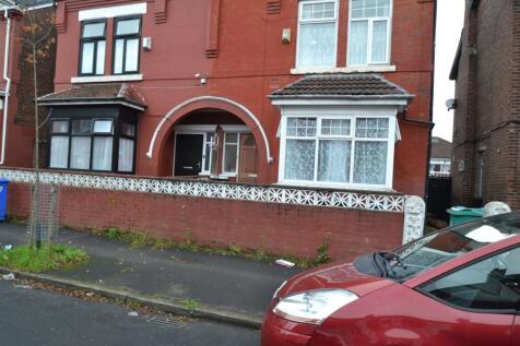 Red-brick semi-detached house frontage with dec...