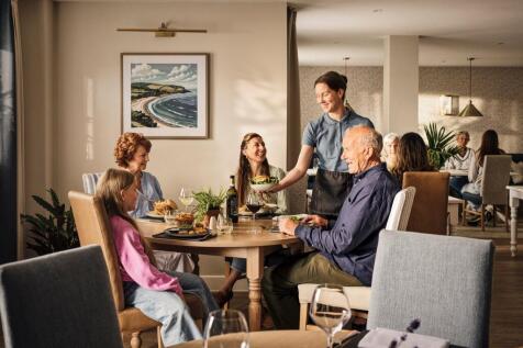 a group of people sitting around a table