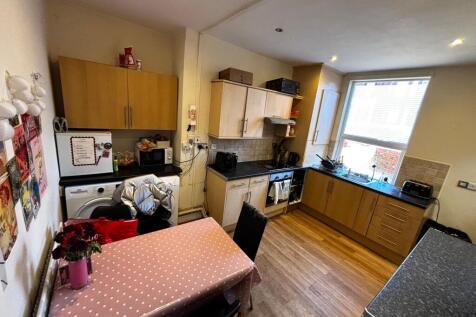 Bright, functional kitchen with generous counte...