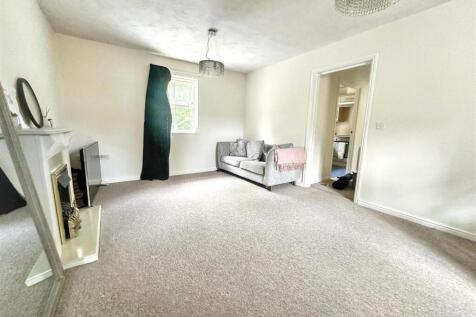 Spacious bright lounge with classic fireplace...