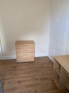 Bright bedroom with ample built-in storage...