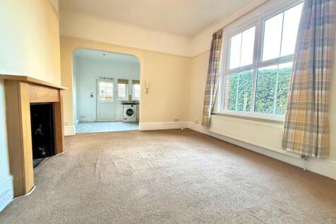 LIVING ROOM OPEN TO KITCHEN DINING ROOM