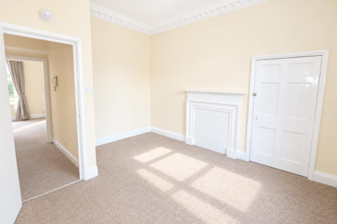 Bright Empty Cream Living Room with Ornate Firepla