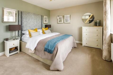 Bedroom 2 offers space for a double bed and storage
