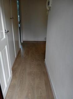 Bright hallway with stylish wood flooring...