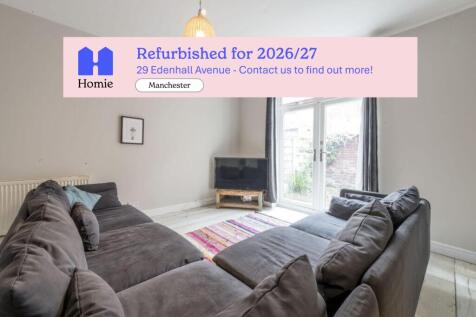 Bright, newly refurbished living room with a la...