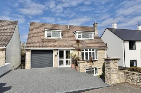 Front with drive and garage
