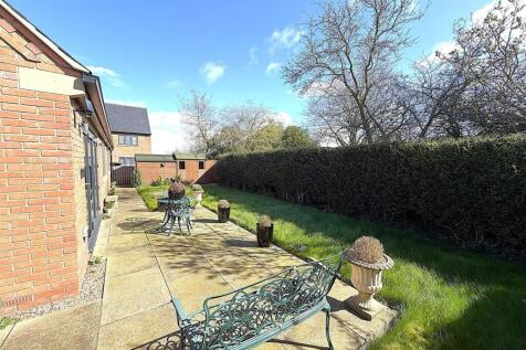 Spacious sunny garden with seating area...