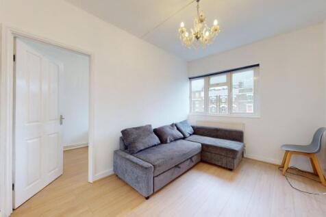 Bright lounge with comfy sofa and chandelier...