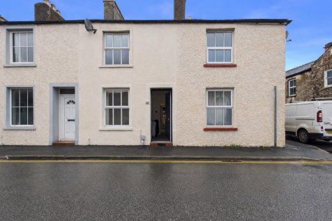 Terraced houses with open door.png