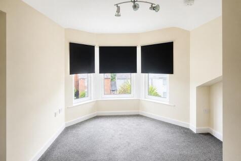 Spacious master bedroom with bright bay window...