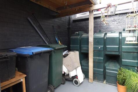 Rear Yard with Cellar/Storage area.