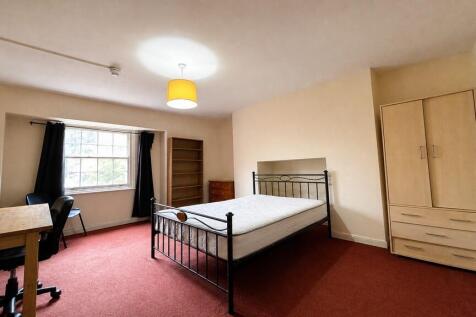 Spacious bedroom with double bed and study desk...